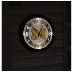 Indoor/Outdoor Officially Licensed Logo LED Clocks shown at night with LED lights lit.